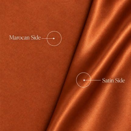 Copper orange Moroccan sablé fabric showing its matte textured face on the left and glossy satin reverse in folds on the right, with white callouts labelled “Marocan Side” and “Satin Side”.