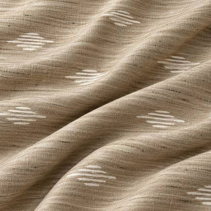 Close-up of sand-beige textured silk in soft diagonal folds, highlighting the irregular woven yarns and short champagne-white geometric stripes.