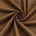 Copper-brown Dupion silk gathered into a central spiral, with soft folds revealing the natural slubbed texture and changing highlights.