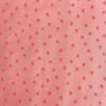 Flat view of soft pink silk jacquard with evenly spaced brighter pink circular motifs, each with a small golden-toned centre, across a fine, subtly lustrous woven ground.