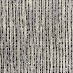 Extreme close-up of an off-white open-weave fabric, showing vertical raised yarns, narrow midnight blue gaps and irregularly spaced fine connecting threads.