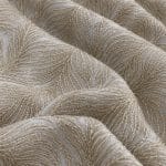 Ivory embroidered chiffon draped in broad folds, showing curved feather-like motifs with closely spaced raised threads and tonal micro sequins.