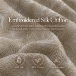 Ivory embroidered chiffon in soft folds, with overlaid text reading “Embroidered Silk Chiffon” and a description of its feather-like motifs, plus three icons describing its fibre content and micro sequins.